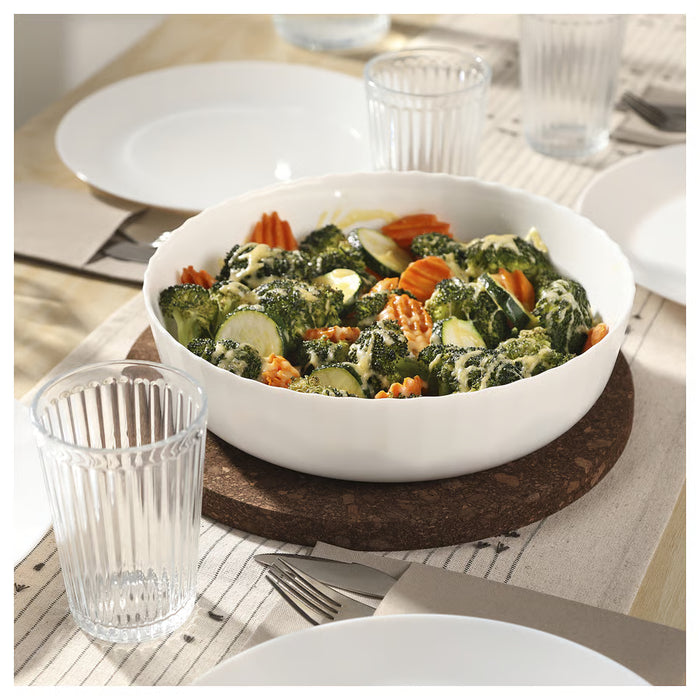 IKEA FISKTÄRNA white oven dish filled with mixed vegetables on wooden dining table