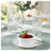 IKEA FISKTÄRNA white pie dish served on dining table with glassware and blue placemat
