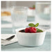IKEA FISKTÄRNA white pie dish with chocolate mousse and raspberries on blue cloth