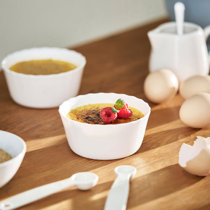 IKEA FISKTÄRNA white ramekins with custard and berries alongside milk and eggs