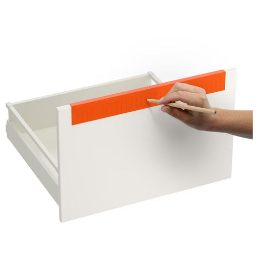 Digital Shoppy Bright orange IKEA FIXA drill template on a tool shelf, highlighting its visibility 10323434