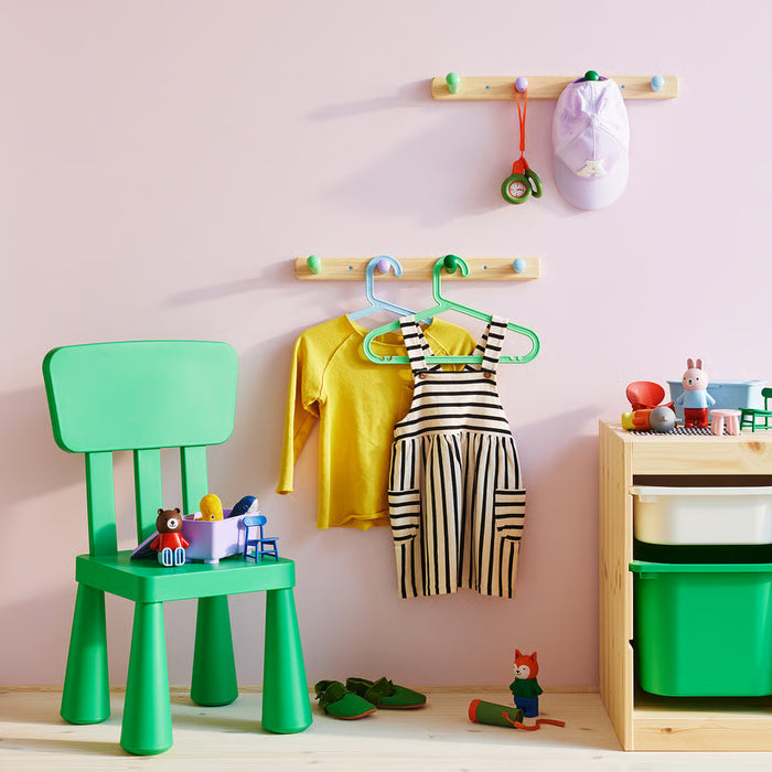 IKEA FLISAT knob rack mounted on wall with backpack hanging in child's bedroom