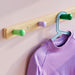 Close-up of IKEA FLISAT cone-shaped wooden knobs in multiple colours