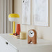 IKEA FLODKRÄFTA cork clock on study desk beside lamp and books minimalist home office setting
