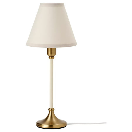 "IKEA table lamp on nightstand providing cozy bedroom lighting-70524458
