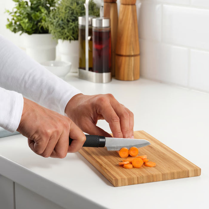 IKEA FÖRSLAG paring knife slicing carrots on a wooden cutting board