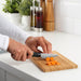 IKEA FÖRSLAG paring knife slicing carrots on a wooden cutting board