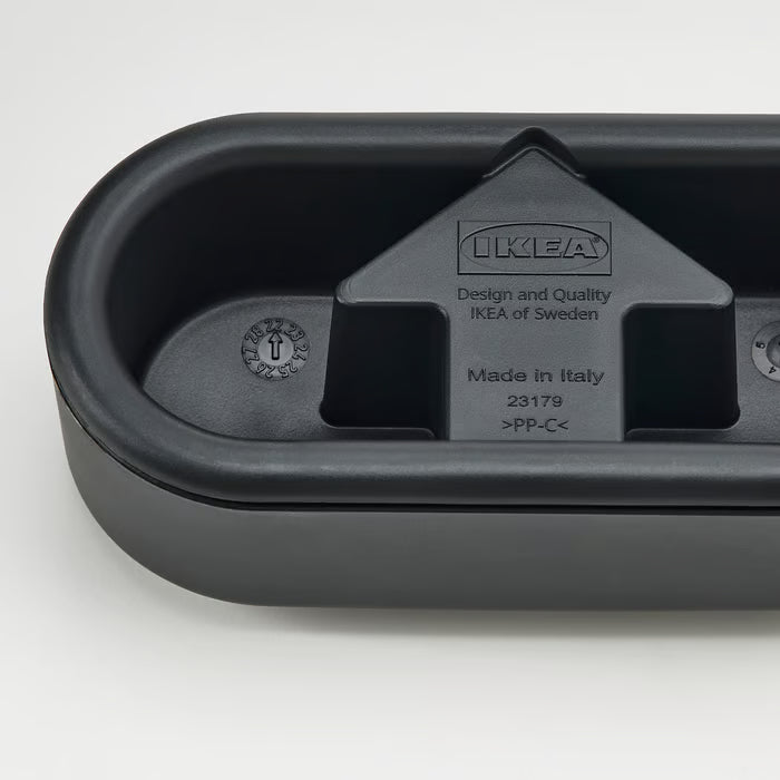 Back of the IKEA FRUKTPLOCKARE black lint brush showing product design engravings