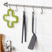 IKEA FULLÄNDAD grey cooking tweezers hanging on kitchen hook alongside other FULLÄNDAD utensils