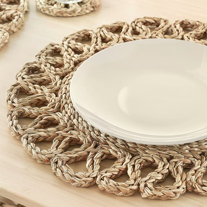 IKEA GALLSOPP round natural place mat under white bowl showing full diameter and weave detail