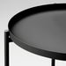  IKEA GLADOM black tray table close-up showing circular tray on sleek powder-coated steel stand