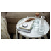 IKEA GLADOM white tray table in a living room setting styled with cushions and indoor plant