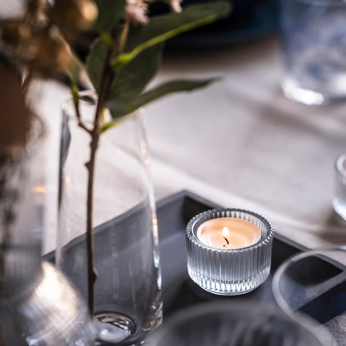  IKEA GLIMMA unscented tealight single candle in aluminium cup close-up white background