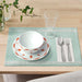 An image of a sleek and elegant orangeplate from IKEA, perfect for serving meals at a dinner party