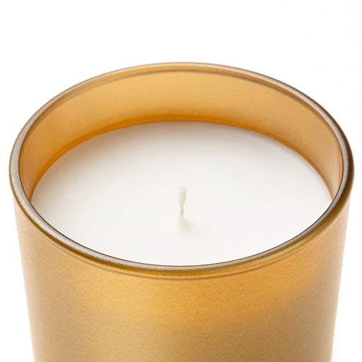 IKEA GOKVÄLLÅ gold glass candle unlit close-up showing tinted glass vessel and cotton wick