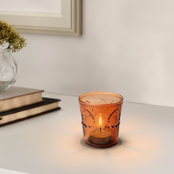 "IKEA tealight holder set with candles, creating a soft, inviting light.-40573860
