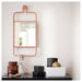 IKEA GRANVÅG pink mirror styled on white shelf with flowers and candle