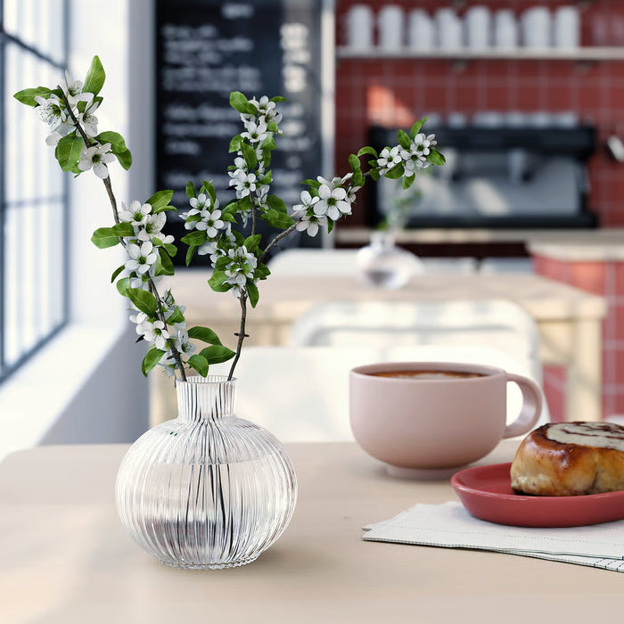 Close-up of IKEA GRÅSPARV clear glass vase showing glass texture