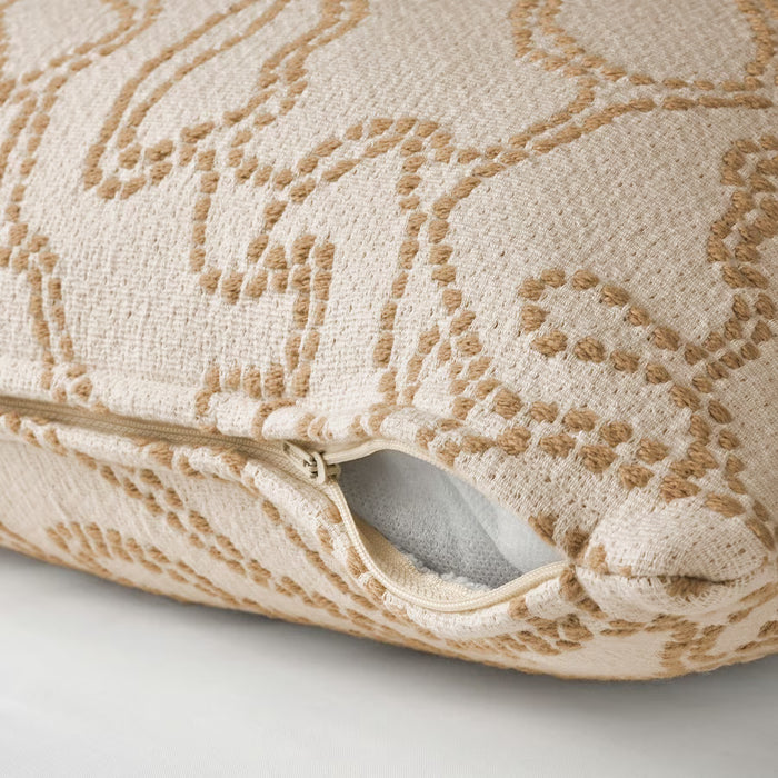 Close-up of a textured pillow with a subtle pattern on a light background