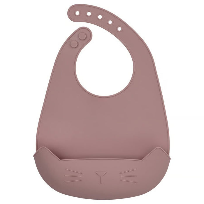 Soft pale pink IKEA GULDVÄVARE baby feeding bib with crumb-catching pocket and adjustable snap closure, made of easy-clean polyester for mess-free mealtimes.