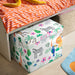 IKEA GULLKRÖS box with lid in playful kids bedroom with striped bedding and toys