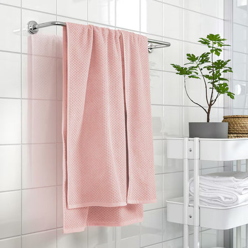 "Stack of folded IKEA bath towels in a bathroom setting"