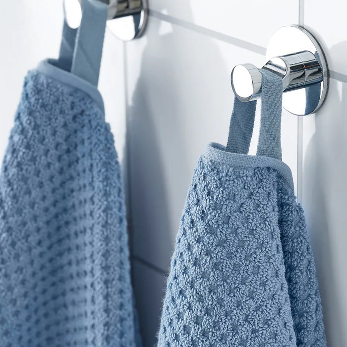 Digital Shoppy "IKEA washcloth hanging in a bathroom, showcasing its soft texture and absorbency."