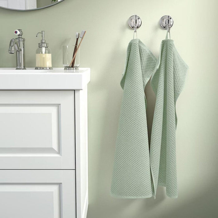 Stylish and functional IKEA GULVIAL hand towel in pale grey-green, 40x70 cm, crafted from durable cotton for daily use. 50579734