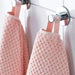 Digital Shoppy "IKEA washcloth hanging in a bathroom, showcasing its soft texture and absorbency."