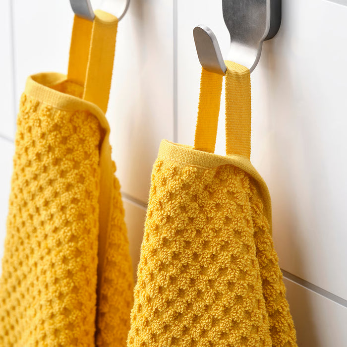 IKEA GULVIAL yellow hand towels hanging side by side on hooks, showing soft absorbent cotton