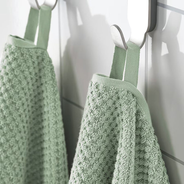 Digital Shoppy "IKEA washcloth hanging in a bathroom, showcasing its soft texture and absorbency."