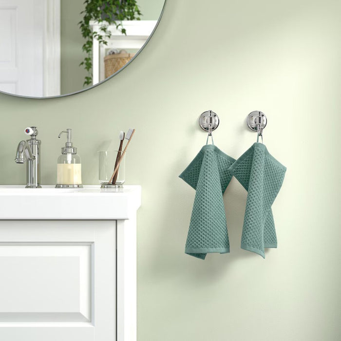 Digital Shoppy "IKEA washcloth hanging in a bathroom, showcasing its soft texture and absorbency."