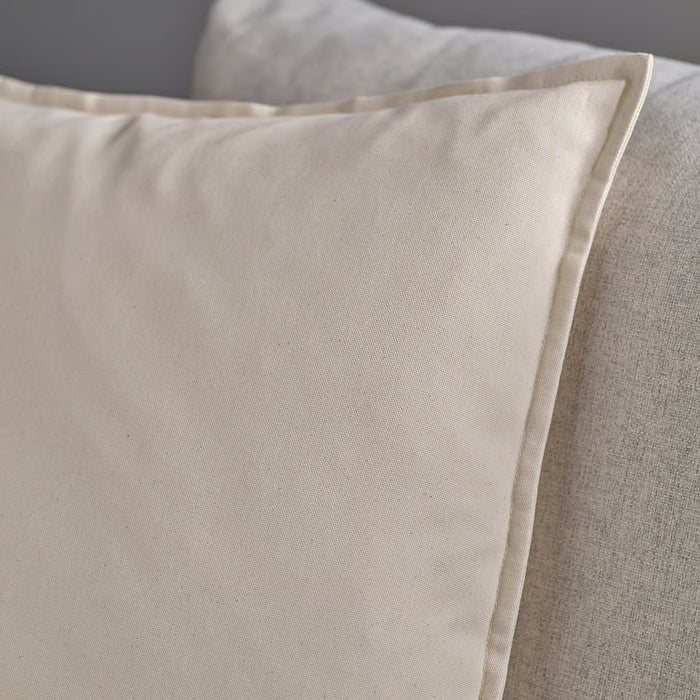 Close-up of IKEA GURLI cushion cover in smooth recycled cotton with neat stitching