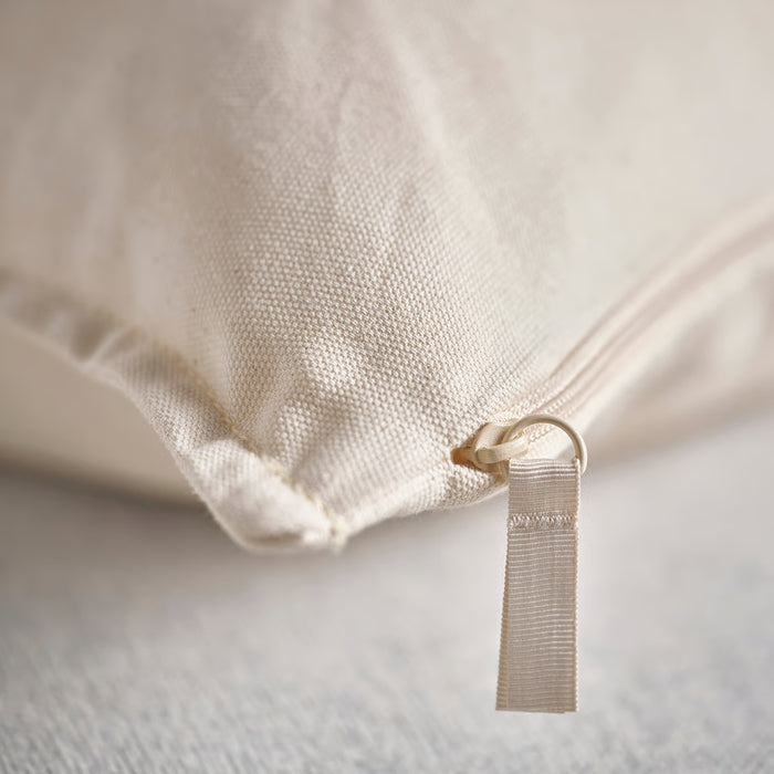 Close-up of zipper on IKEA GURLI unbleached cotton cushion cover showing fabric texture