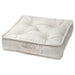 White quilted pet bed on a white background