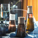  IKEA HALVTOM salt pepper shakers styled on blue tablecloth with seasoning jars and plant vase
