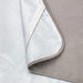 Close-up corner of IKEA HAMPPALM mattress protector showing smooth fabric and overlock stitching detail
