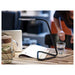 IKEA HÅRTE LED work lamp black silver in use on a study desk warm white light