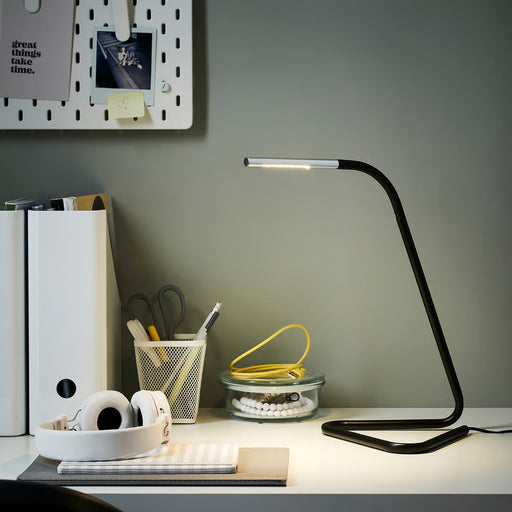 IKEA HÅRTE LED work lamp black silver angled view showing slim metal pipe design