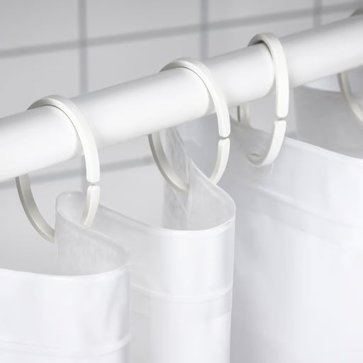 IKEA HASSJÖN white oval curtain rings close-up showing minimalist open-ended design