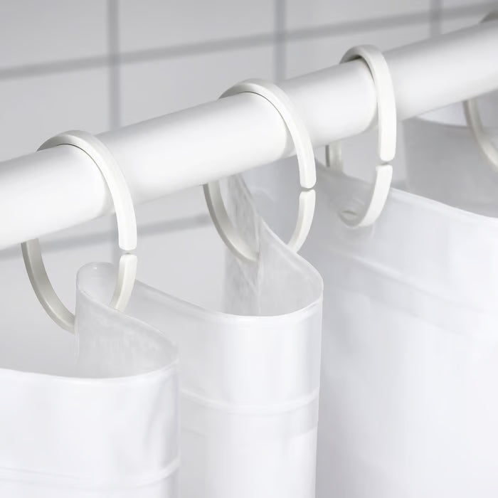 IKEA HASSJÖN white oval curtain rings close-up showing minimalist open-ended design