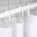 IKEA HASSJÖN white oval curtain rings close-up showing minimalist open-ended design