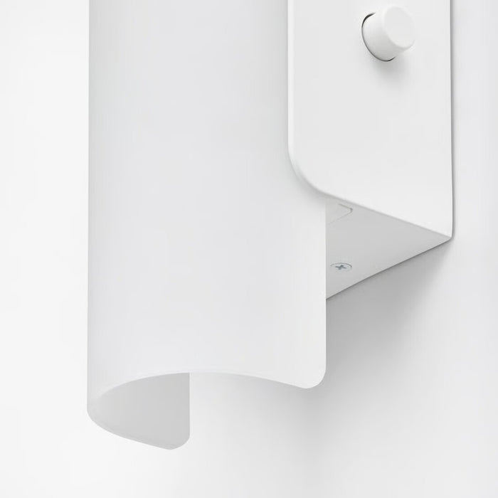 White wall-mounted lamp with a curved design on a white background