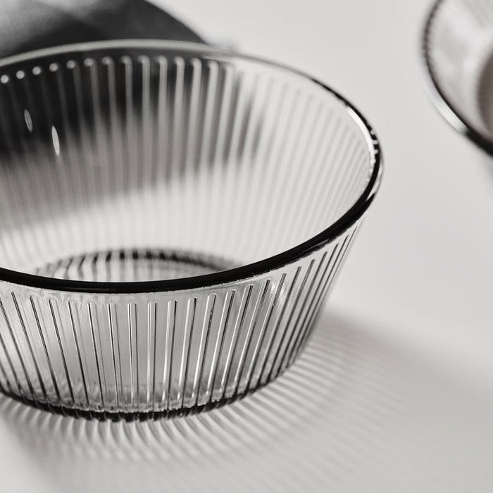 IKEA HAVSGÄDDA pink ribbed glass bowl next to a clear drinking glass and a spoon
