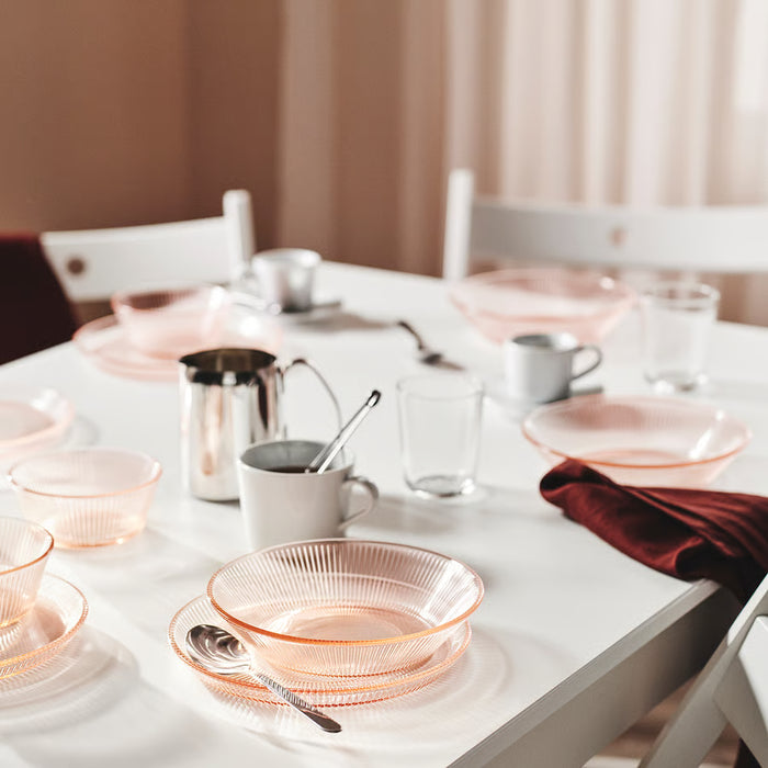 Table set with IKEA HAVSGÄDDA pink bowls and white cups on white cloth
