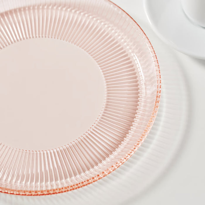 Close-up of IKEA HAVSGÄDDA pink ridged tempered glass side plate showing stripe pattern detail