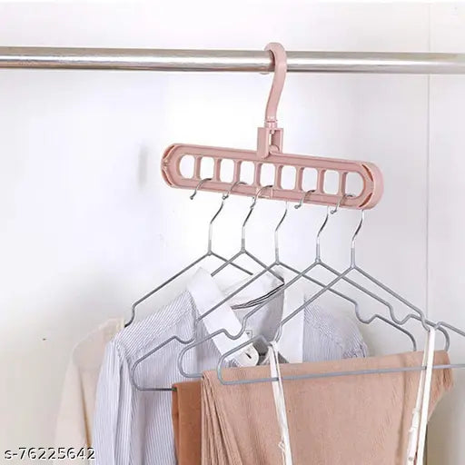 Digital Shoppy's foldable pink clothes hanger with 9 holes for organizing multiple garments vertically