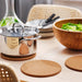  IKEA HEAT cork pot stand placed under hot pot on kitchen countertop showing surface protection