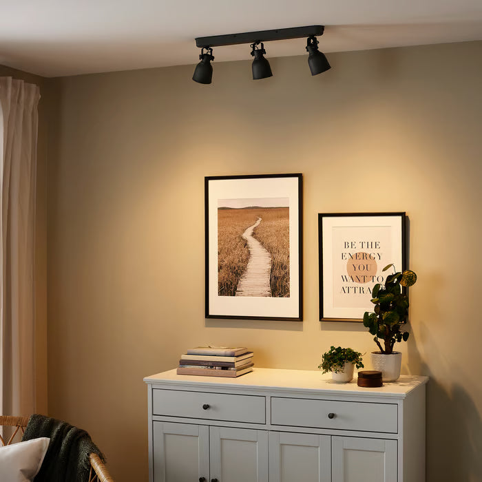  IKEA HEKTAR dark grey ceiling track spotlights illuminating wall art and home decor