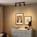  IKEA HEKTAR dark grey ceiling track spotlights illuminating wall art and home decor